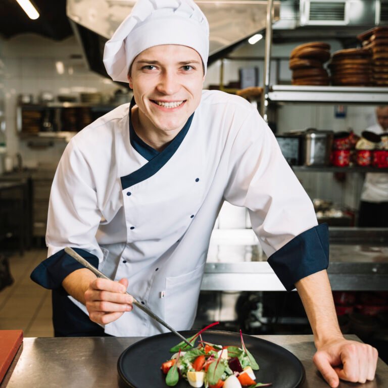 happy-cook-putting-spinach-plate-with-salad