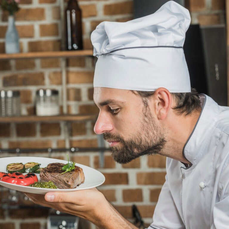 male-chef-smelling-delicious-prepared-dish